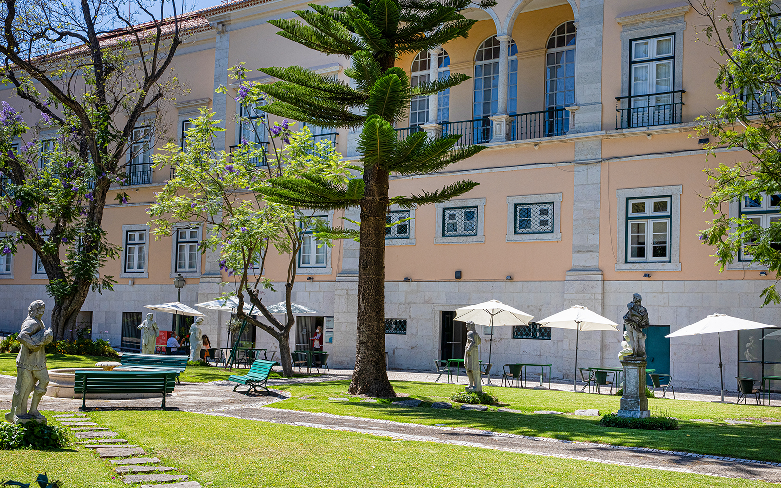 Courtyard with statues and seating at the National Museum of Ancient Art, Lisbon.