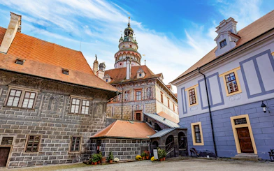 Český Krumlov Castle exterior with tower and historic buildings, Czech Republic.