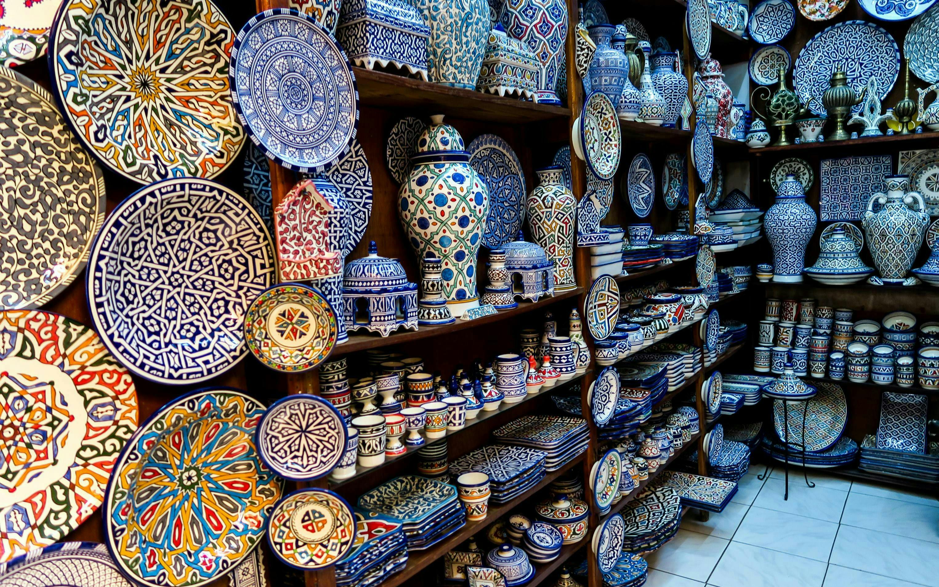 Ceramic plates and pottery in a shop at Fes Old Medina souks, Morocco.