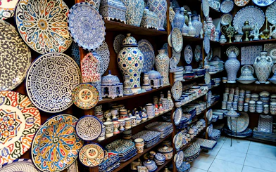 Ceramic plates and pottery in a shop at Fes Old Medina souks, Morocco.