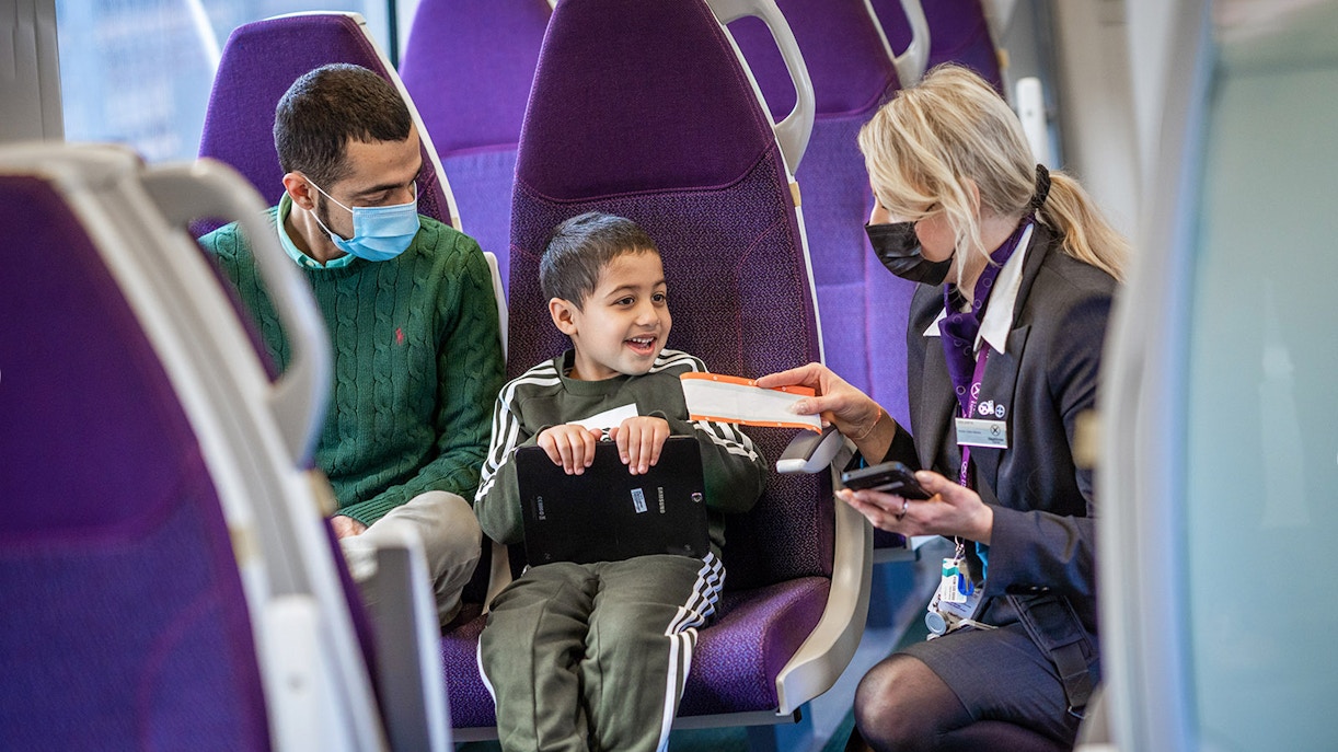 Staff talking to passengers