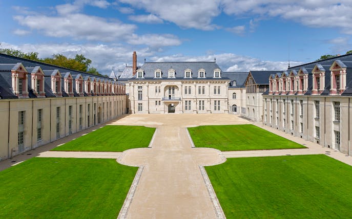 Courtyard of Cité internationale de la langue française with historic architecture.