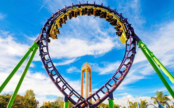 Rollercoaster loop at Six Flags Mexico against a blue sky.