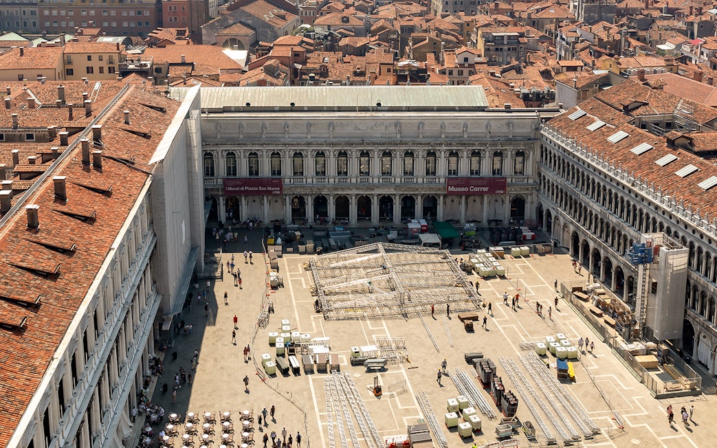 Aerial view of Correr Museum in Venice with people walking in the courtyard.