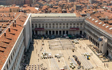 Aerial view of Correr Museum in Venice with people walking in the courtyard.