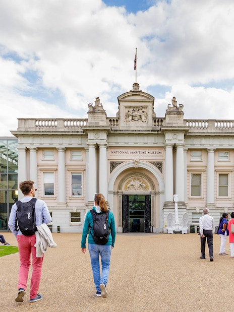 Visitors walking towards the National Maritime Museum entrance in London.