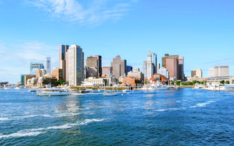 Boston skyline with boats on the harbor, Massachusetts.