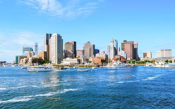 Boston skyline with boats on the harbor, Massachusetts.