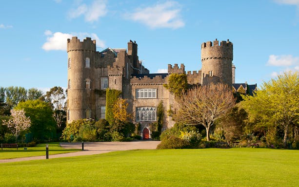 Medieval castle with towers and gardens in Dublin, Ireland.