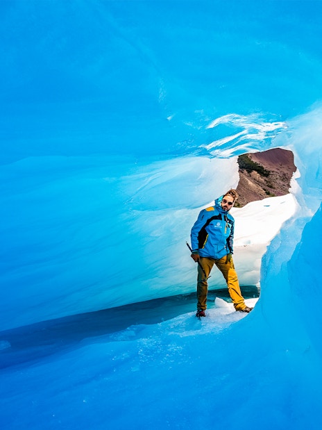 Tourist exploring ice caves at Big Ice, Perito Moreno Glacier, Argentina.