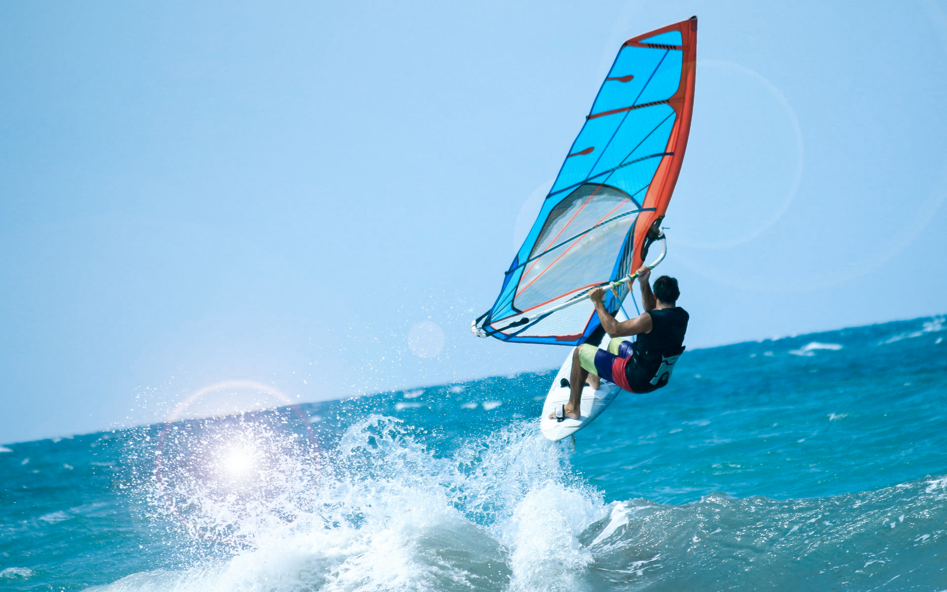 Windsurfer catching air over waves in Delta Neretva, Croatia.