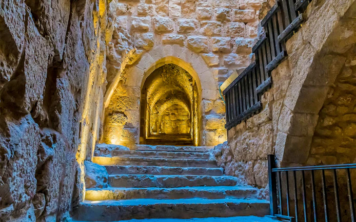 Steps leading through a stone corridor inside Ajloun Castle, Jordan.