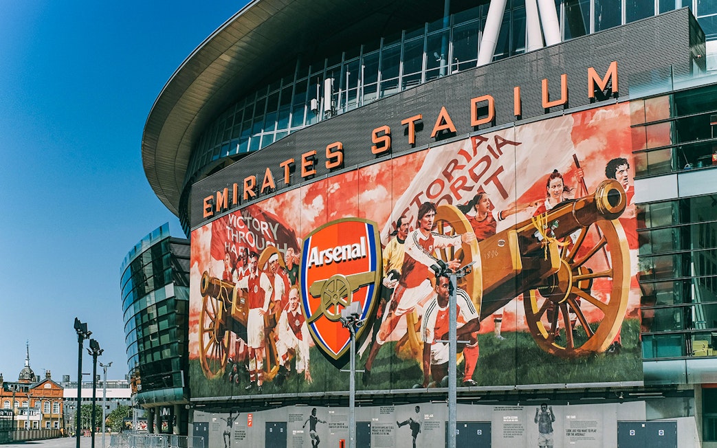 Emirates Stadium exterior with Arsenal mural, part of the Arsenal FC audio tour.