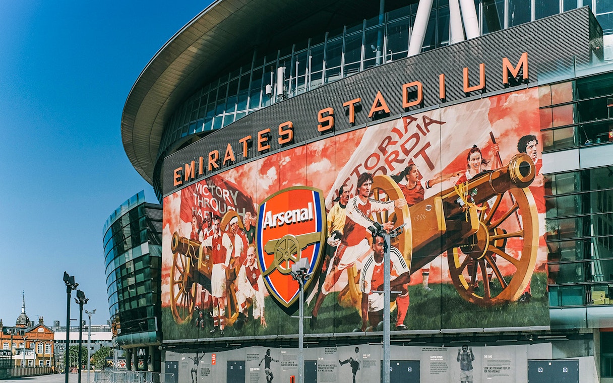 Emirates Stadium exterior with Arsenal mural, part of the Arsenal FC audio tour.