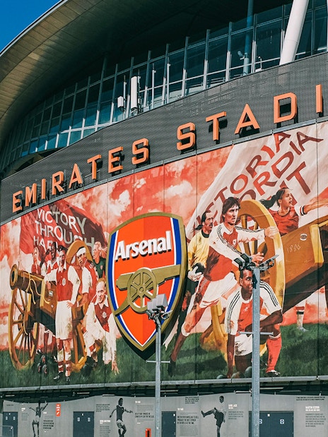 Emirates Stadium exterior with Arsenal mural, part of the Arsenal FC audio tour.