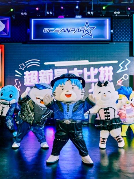 Costumed characters performing on stage at Ocean Park.