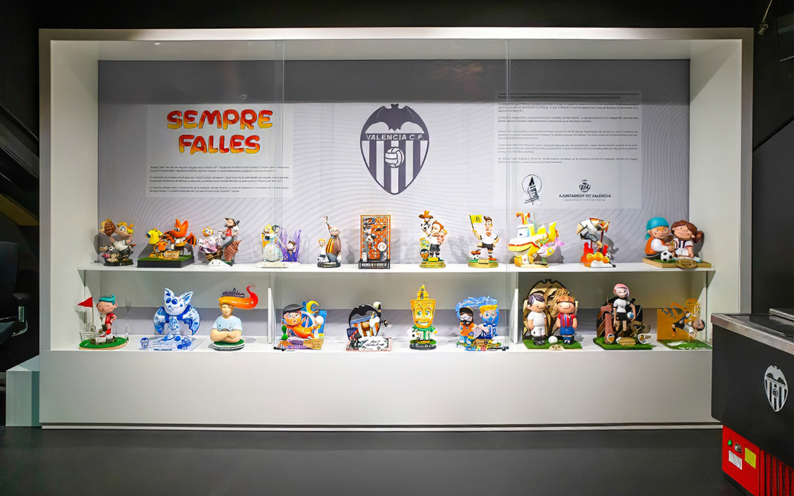Valencia CF Mestalla tour display with colorful figurines and club emblem.