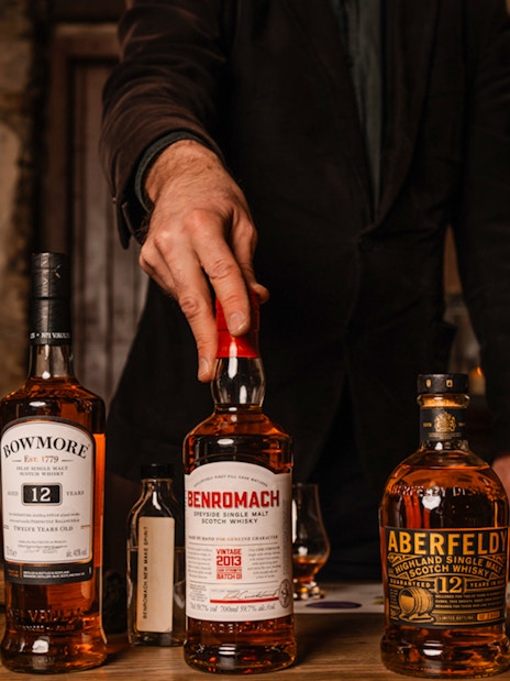 Whisky bottles on display during an underground tasting tour in Edinburgh.