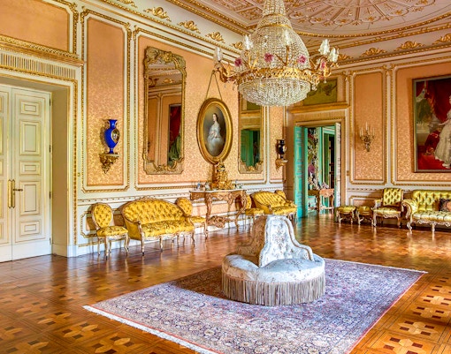 Liria Palace exterior in Madrid with ornate architecture and lush gardens.