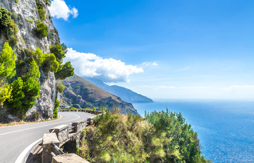 Coastal road along cliffs with sea view on the Amalfi Coast, Italy.