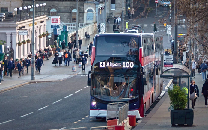 Airport 100 bus at Edinburgh Waverley Station for express transfer to Edinburgh Airport.