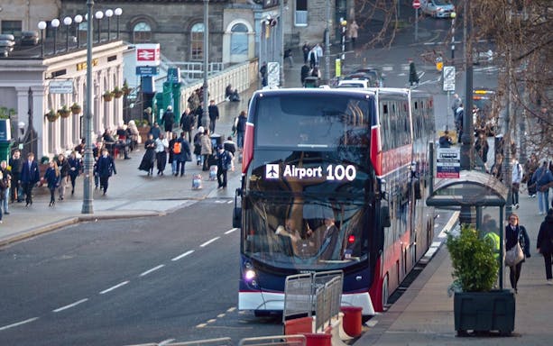 Airport 100 bus at Edinburgh Waverley Station for express transfer to Edinburgh Airport.