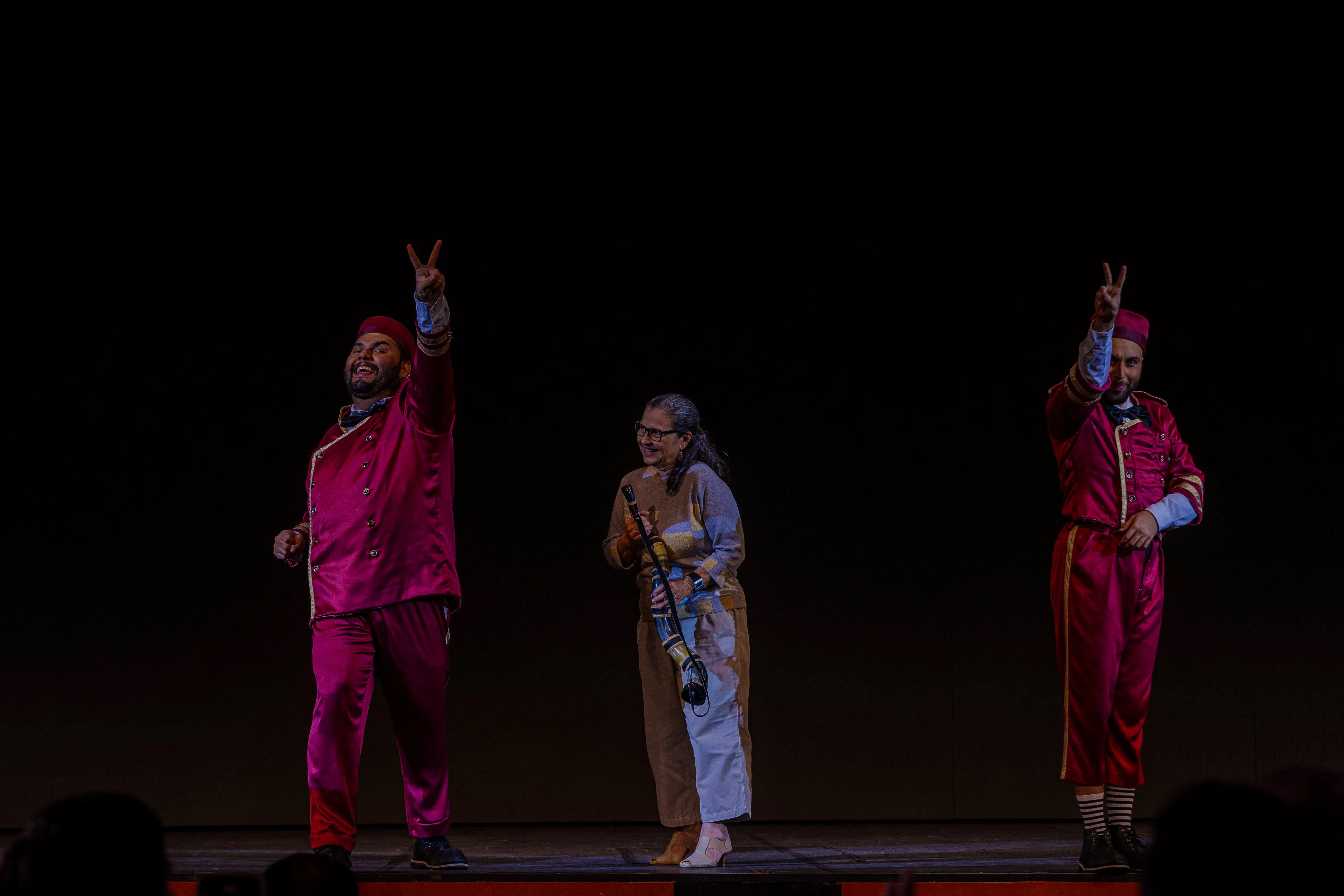 Performers in vibrant costumes on stage at Roxy Dinner Show, Rio de Janeiro.