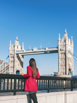 Person admiring Tower Bridge in London.