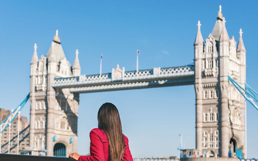 Person admiring Tower Bridge in London.