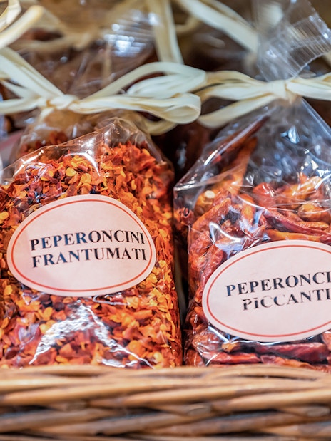 Bags of Italian spices and pasta mixes on display during a Florence food tour.