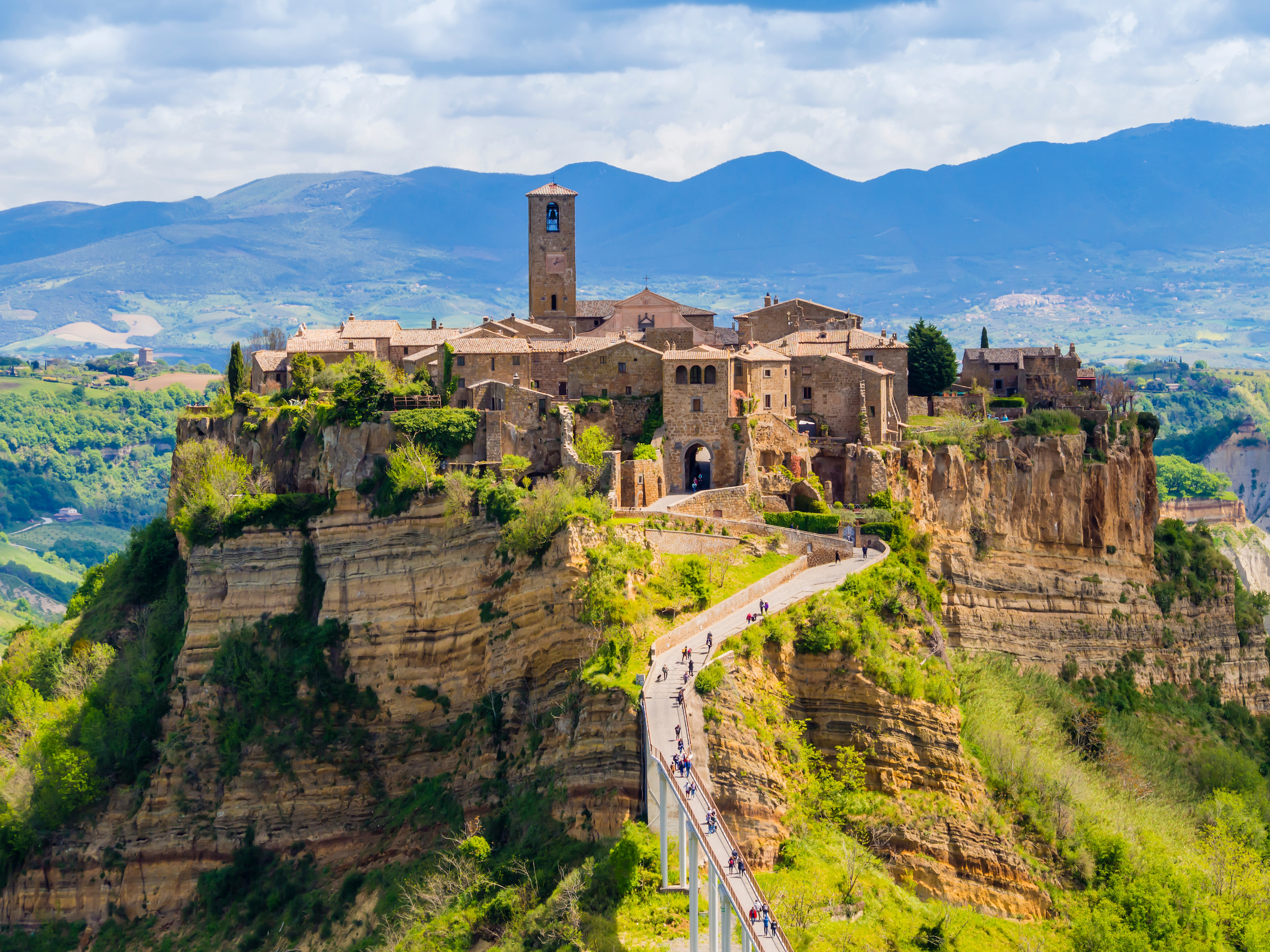 Civita di Bagnoregio perched on a hilltop in Viterbo, Italy, surrounded by lush valleys.