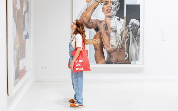 Visitor viewing Robin Kid artwork at Moco Museum, Barcelona.