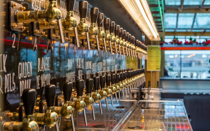 Beer taps lined up for tasting at a Brussels brewery.