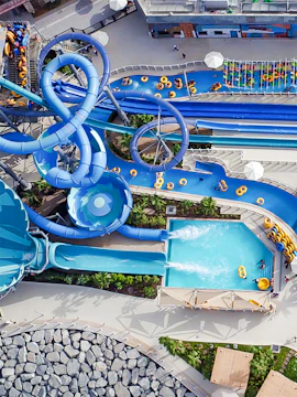 Laguna Waterpark Dubai aerial view with water slides and pool.