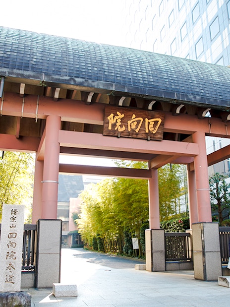 Entrance to Ryogoku Kokugikan sumo stadium in Tokyo, Japan, with traditional gate and signage.