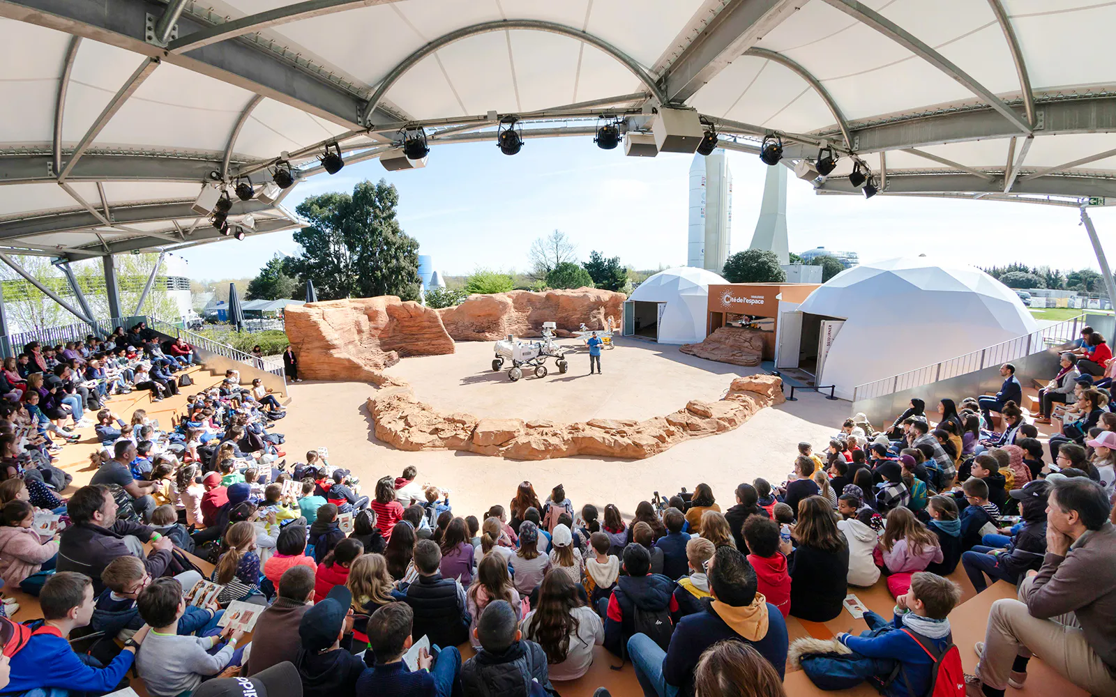 Audience watching a Mars rover demonstration at Cité de l’Espace, France.