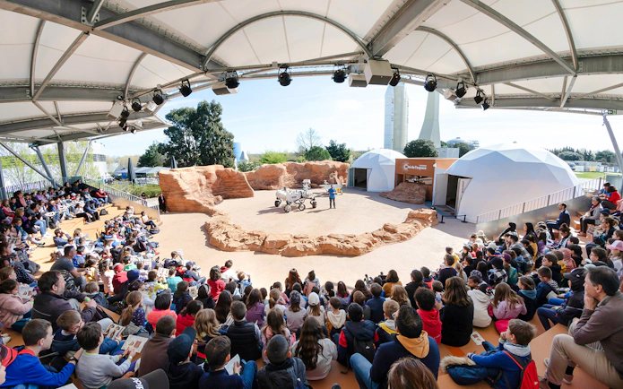 Audience watching a Mars rover demonstration at Cité de l’Espace, France.