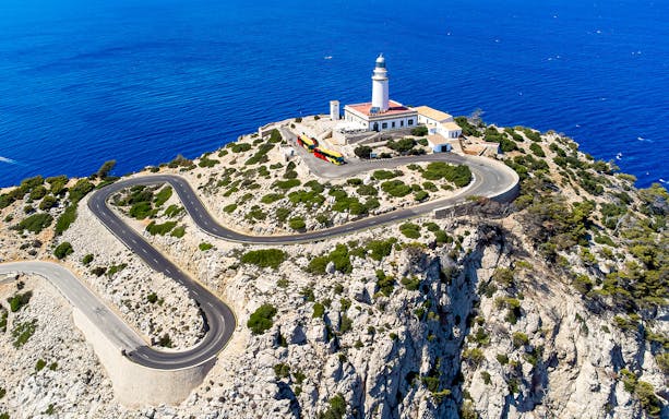 Cap Formentor lighthouse with winding road and sea view, Mallorca.