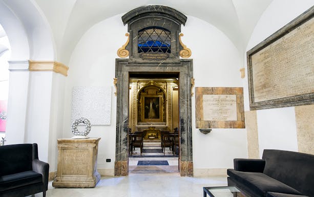 Entrance to concert hall for Great Opera Arias in Rome, featuring ornate interior and seating.