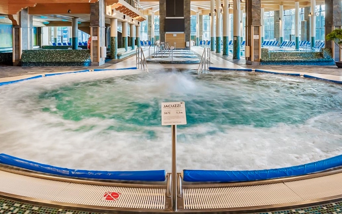Indoor pool area with jacuzzi at Chocholow Thermal Baths.