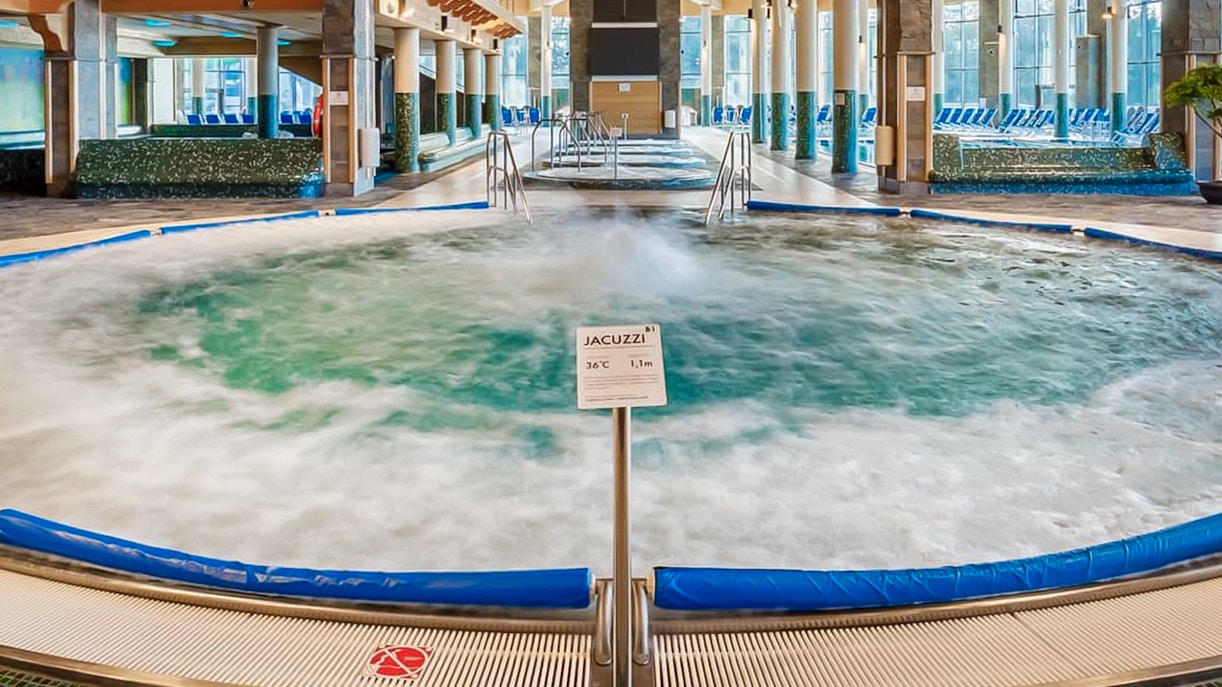 Indoor pool area with jacuzzi at Chocholow Thermal Baths.