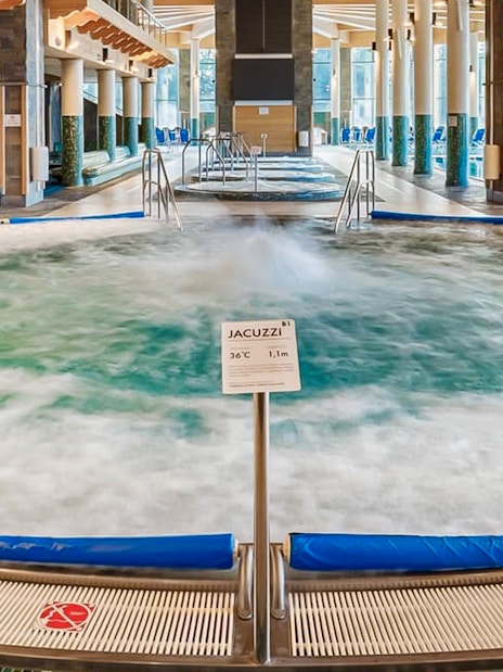 Indoor pool area with jacuzzi at Chocholow Thermal Baths.