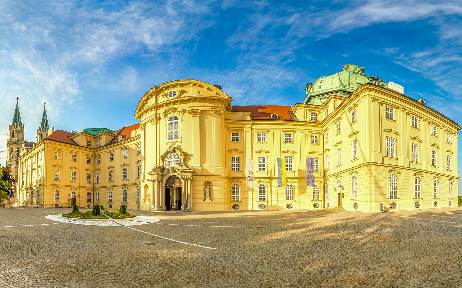 Klosterneuburg Monastery exterior with guided tour group in Vienna, Austria.