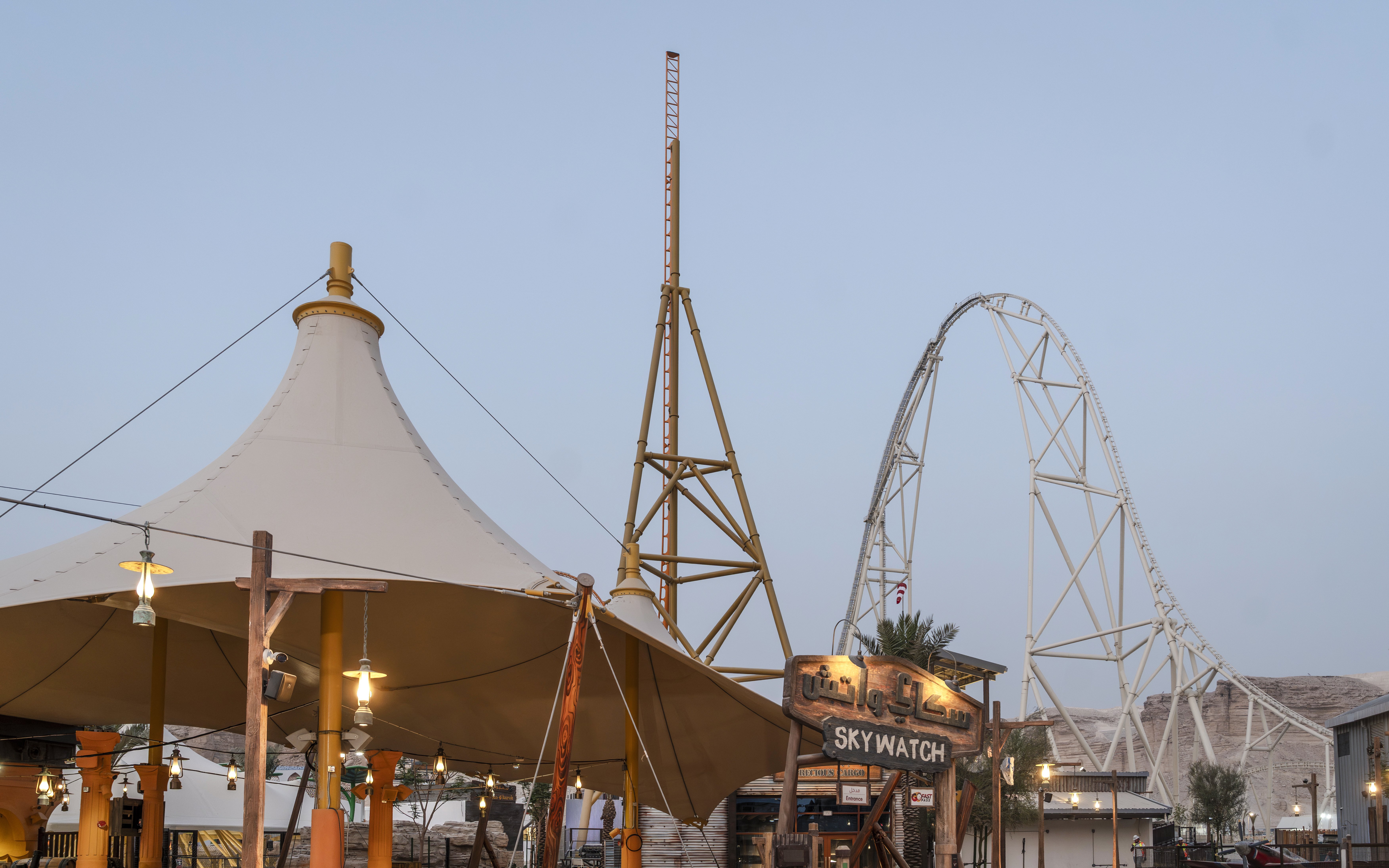 Roller coaster and Skywatch sign at Valley of Fortune, Six Flags Qiddiya City.
