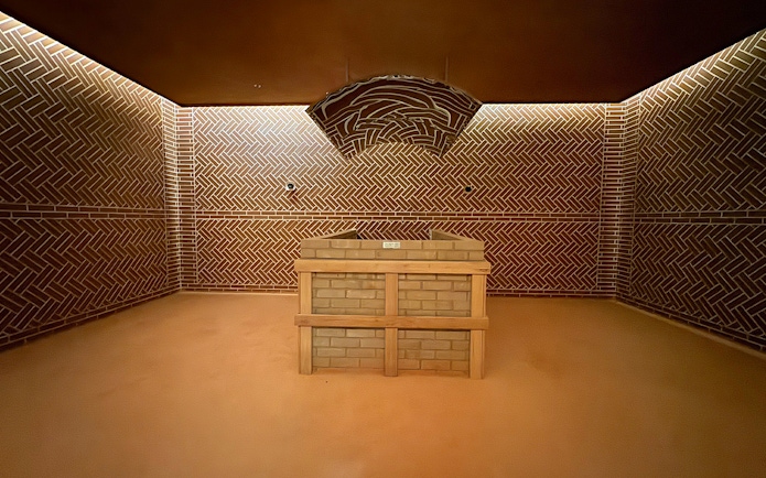Aqua field sauna interior at VinPearl Harbour, Nha Trang, Vietnam with brick design.