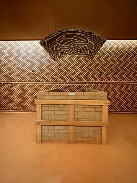 Aqua field sauna interior at VinPearl Harbour, Nha Trang, Vietnam with brick design.