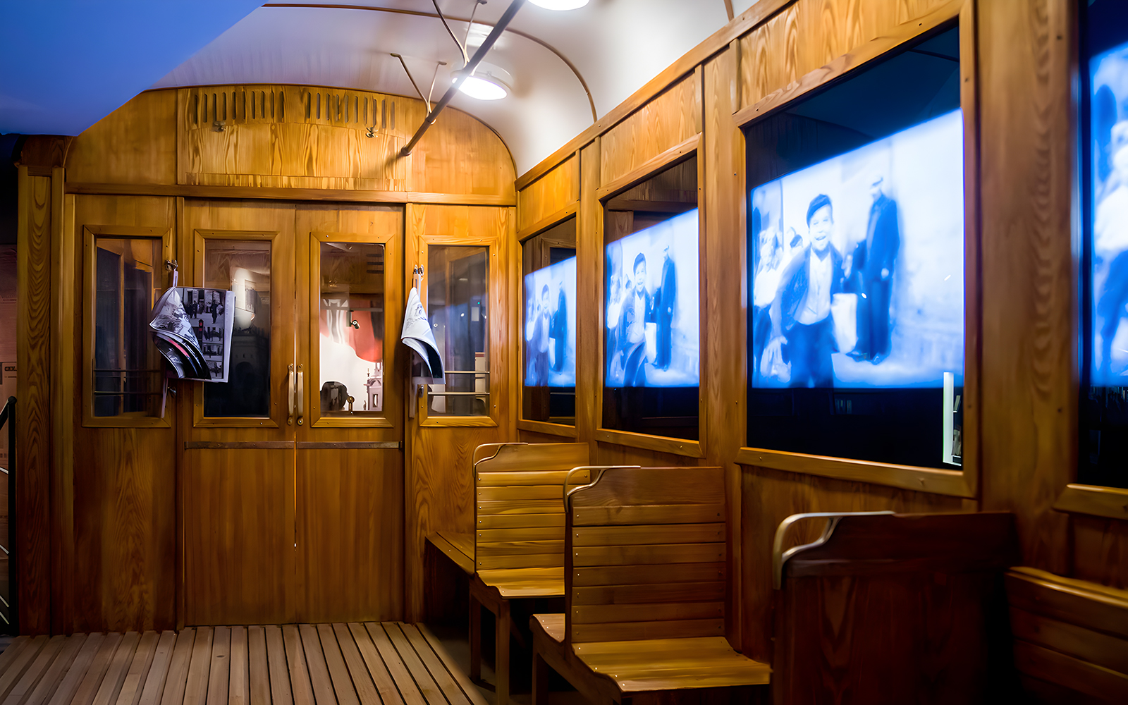 Video screens inside Schindler's Factory Museum exhibit in Krakow.