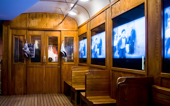 Video screens inside Schindler's Factory Museum exhibit in Krakow.