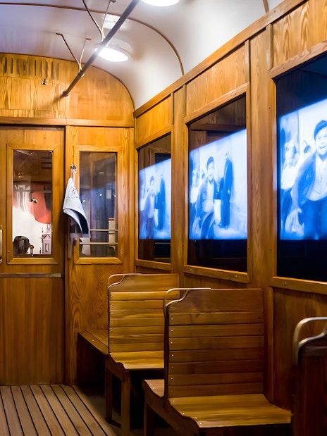 Video screens inside Schindler's Factory Museum exhibit in Krakow.