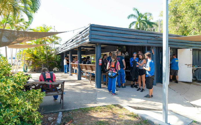 Visitors preparing for tandem skydive at Airlie Beach facility.